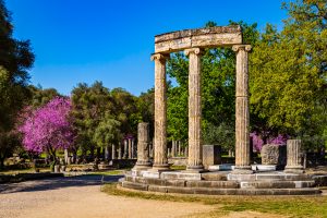 The Ruins of Ancient Olympia With Blooming Cercis Tree Greece.