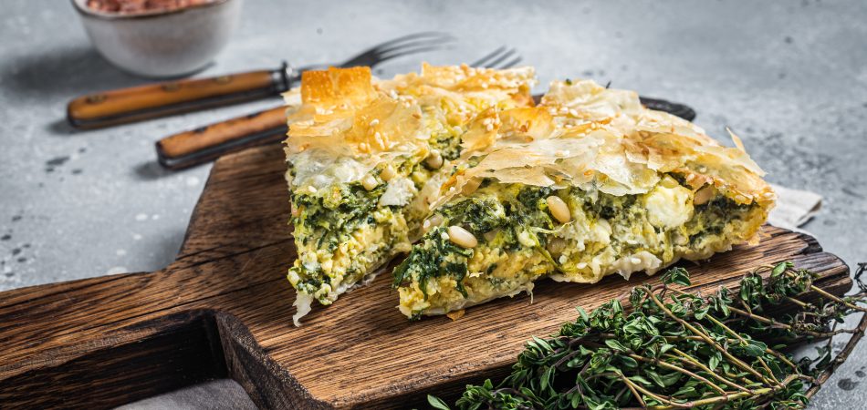 Greek,Pie,Spanakopita,With,Spinach,And,Cheese,On,Wooden,Board.