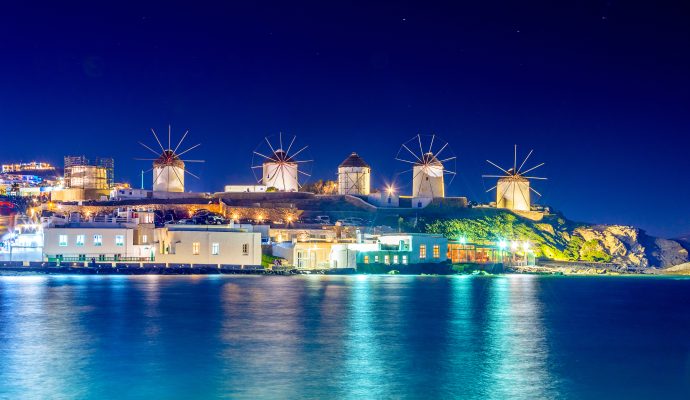 Mykonos Port with Boats and Windmills at Evening.