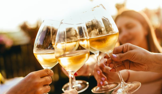 People Clinking Glasses with Wine on the Summer Terrace