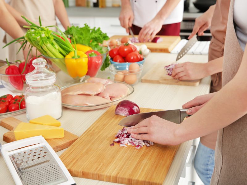 People,Cutting,Onion,at,Cooking,Classes
