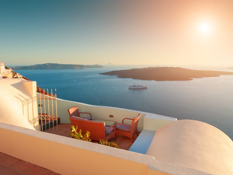 Beautiful,Sunset,At,Santorini,Island,,Greece.,Chairs,On,The,Terrace