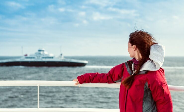 girl-ferryboat-looks-towards-sea-where-liner-floats_100073-879