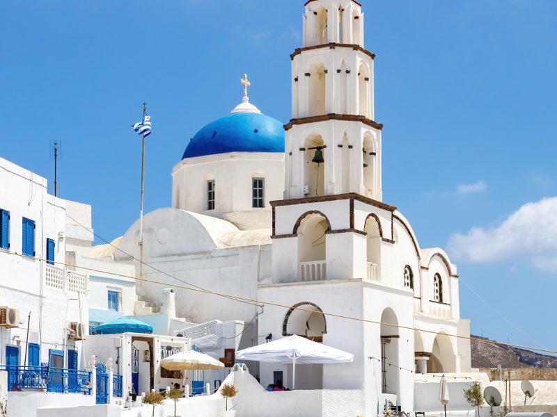 Walking Through Santorini Streets. Traditional Greek White Houses Architecture.