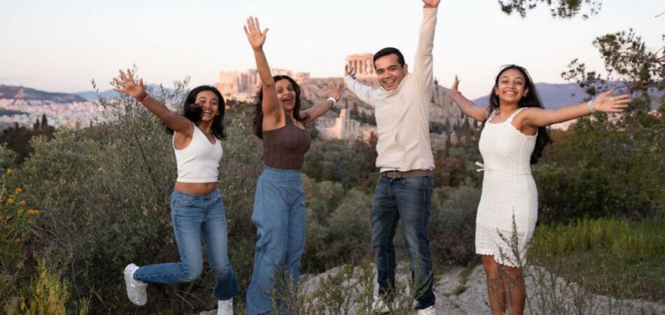 Family visiting Acropolis Athens Greece tourists exploring Parthenon landmark